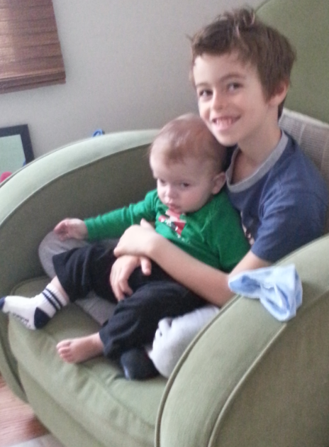 Aidan holding his little brother :) | Help Kaden